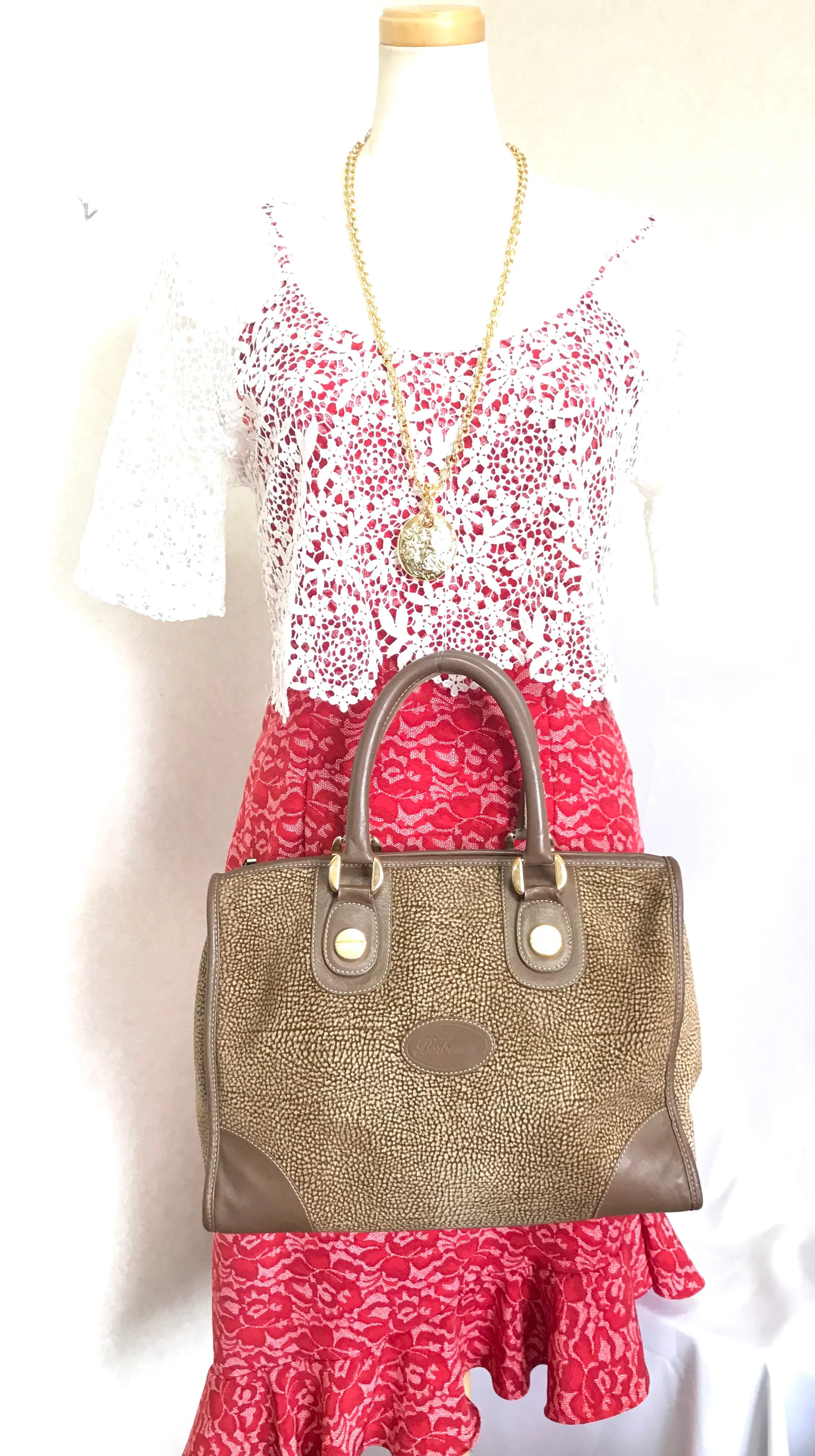 Vintage Borbonese by red wall, brown and beige leather classic bag with golden logo charm.  Unisex use. Masterpiece.
