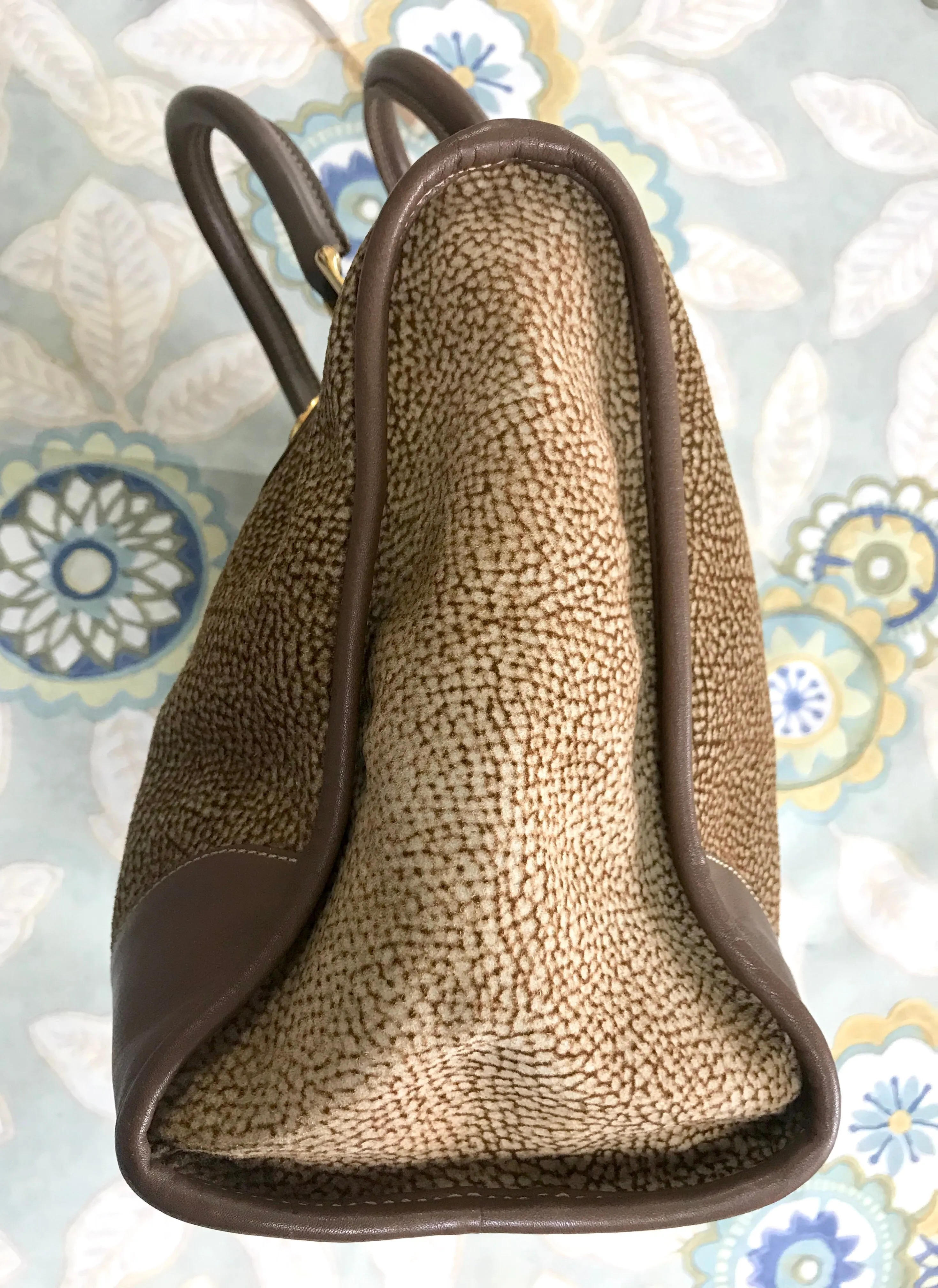 Vintage Borbonese by red wall, brown and beige leather classic bag with golden logo charm.  Unisex use. Masterpiece.
