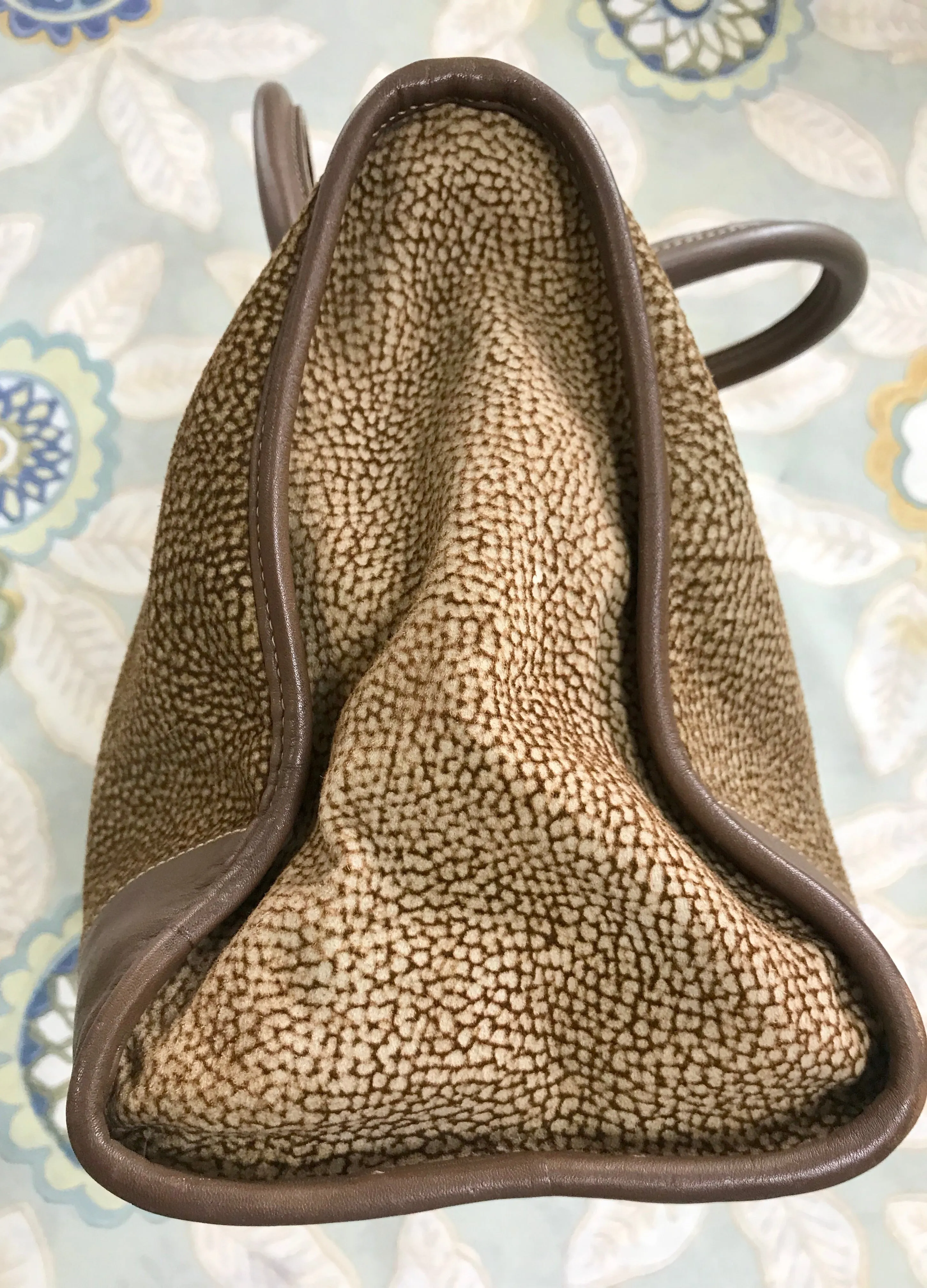 Vintage Borbonese by red wall, brown and beige leather classic bag with golden logo charm.  Unisex use. Masterpiece.