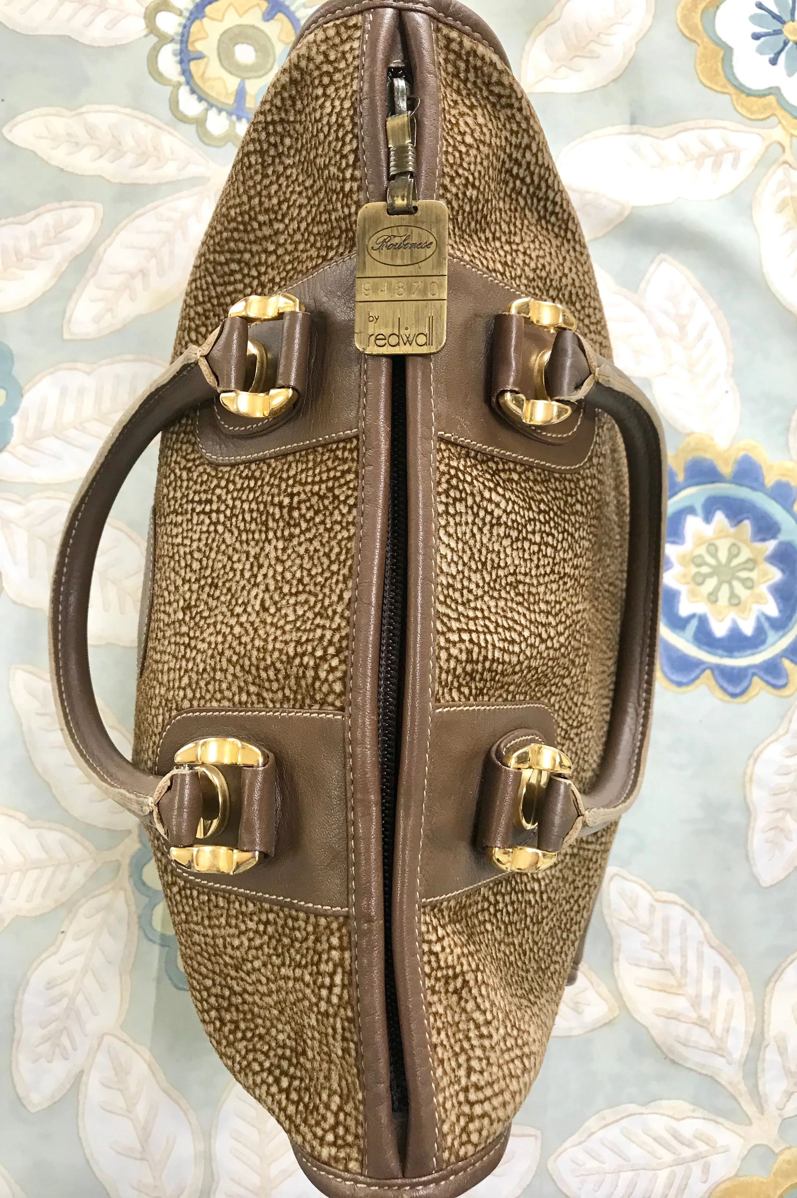 Vintage Borbonese by red wall, brown and beige leather classic bag with golden logo charm.  Unisex use. Masterpiece.