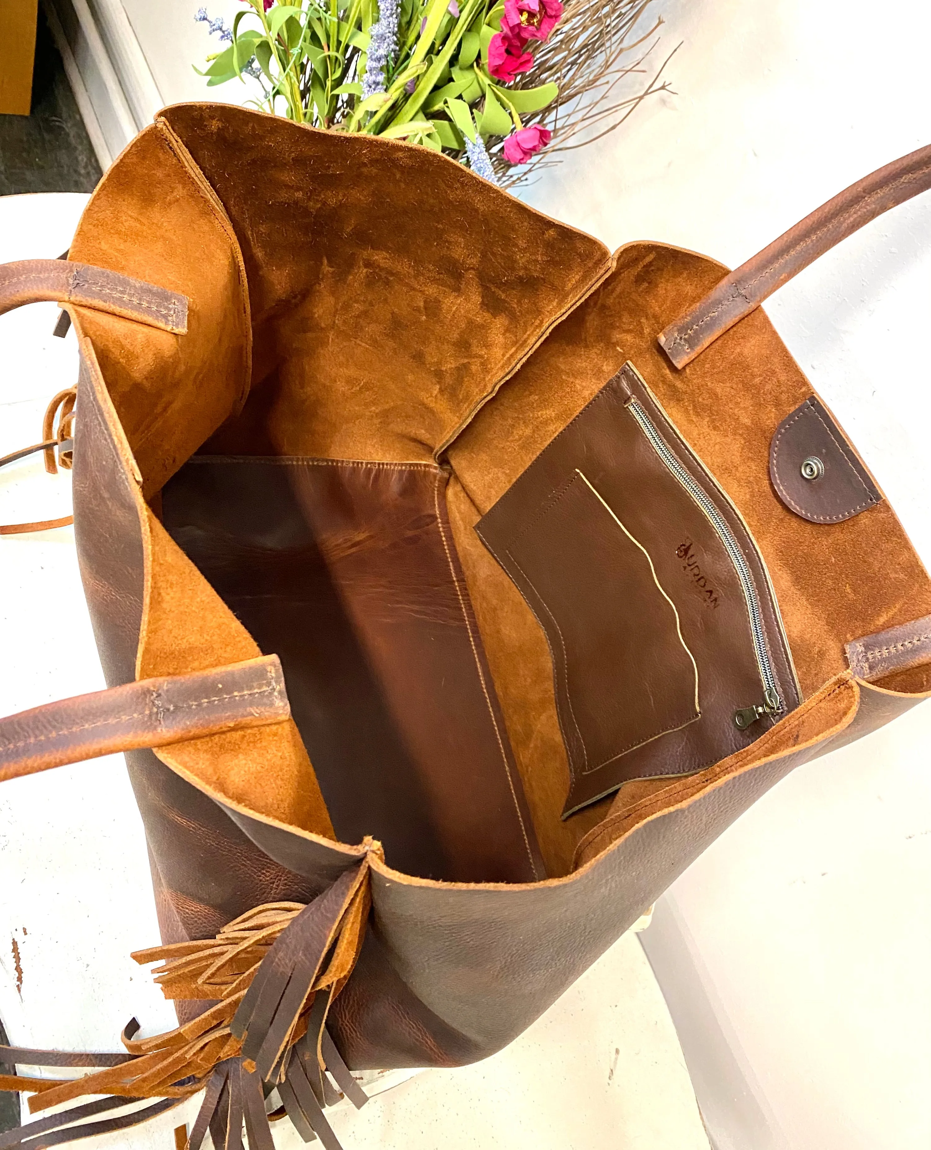 Vintage brown leather tote with side fringe